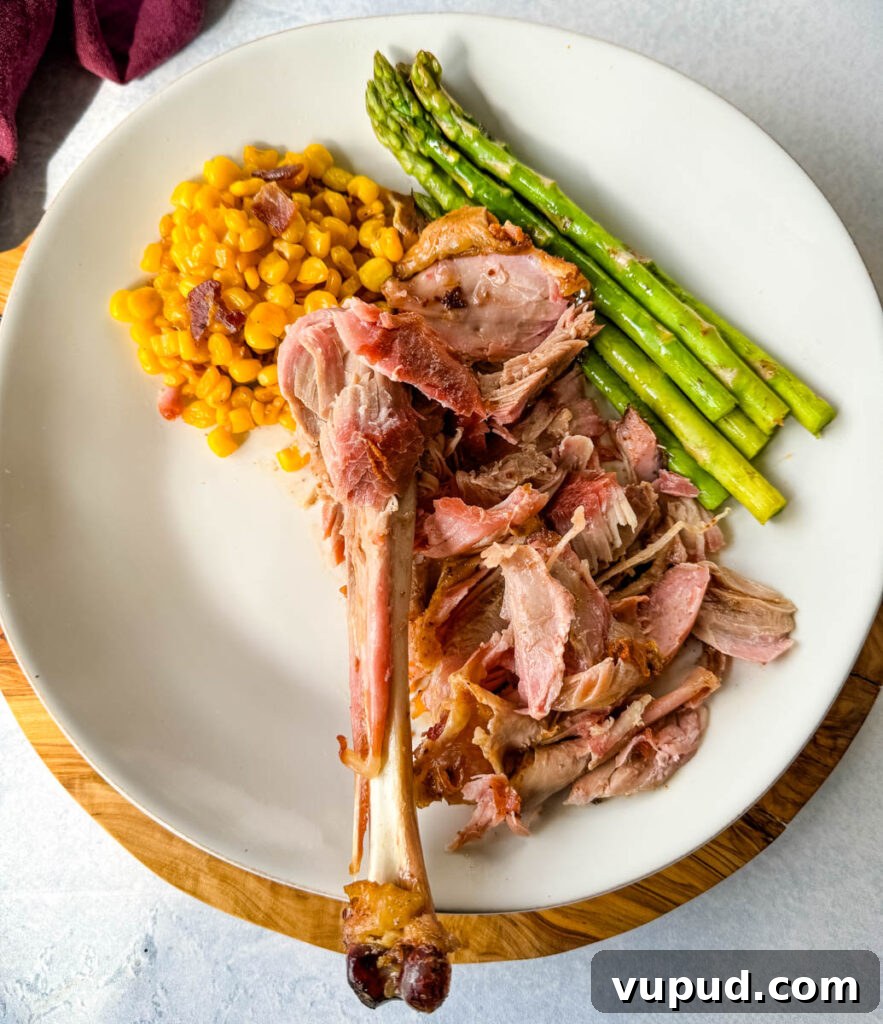 Smoky Traeger Turkey Legs Recipe: Juicy Wood-Fired Flavor 14 fall off the bone smoked turkey legs on a plate