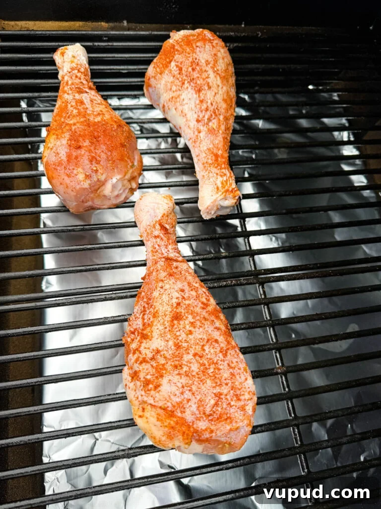 Smoky Traeger Turkey Legs Recipe: Juicy Wood-Fired Flavor 8 seasoned, raw turkey legs on a Traeger smoker pellet grill