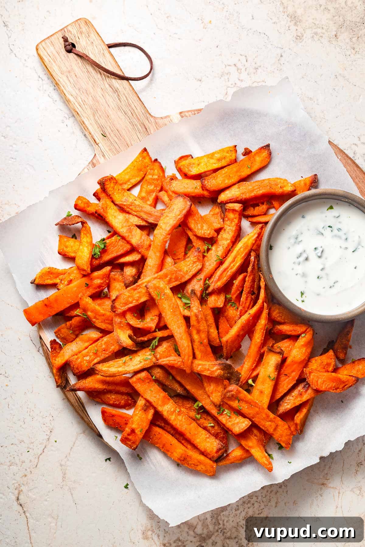 Crispy Air Fryer Frozen Sweet Potato Fries in Minutes 2 frozen sweet potato is air fried and presented with a dip.