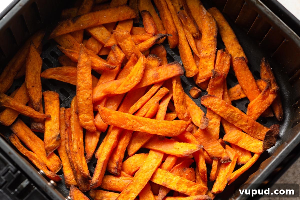 Crispy Air Fryer Frozen Sweet Potato Fries in Minutes 7 air fried frozen sweet potato fries in the air fryer.
