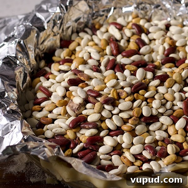 How to Blind-Bake a Pie Crust for a Perfect Fill 9 Weighting down pie dough with dried beans before baking it.