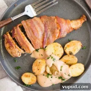 Crispy Bacon-Wrapped Chicken Breasts with Garlic Herb Glaze 9 bacon wrapped chicken served with roasted potatoes