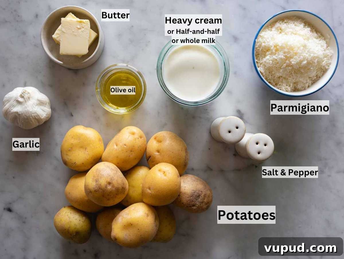Creamy Garlic Mashed Potatoes Recipe 4 Ingredients for garlic mashed potatoes on a marble table.