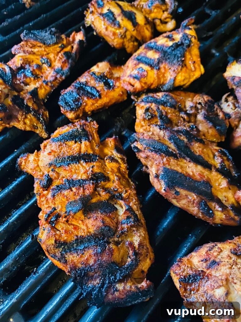 Korean-Style Grilled Chicken Thighs with Sticky Gochujang Glaze 4 Chicken on the grill after flipping but before adding the sauce