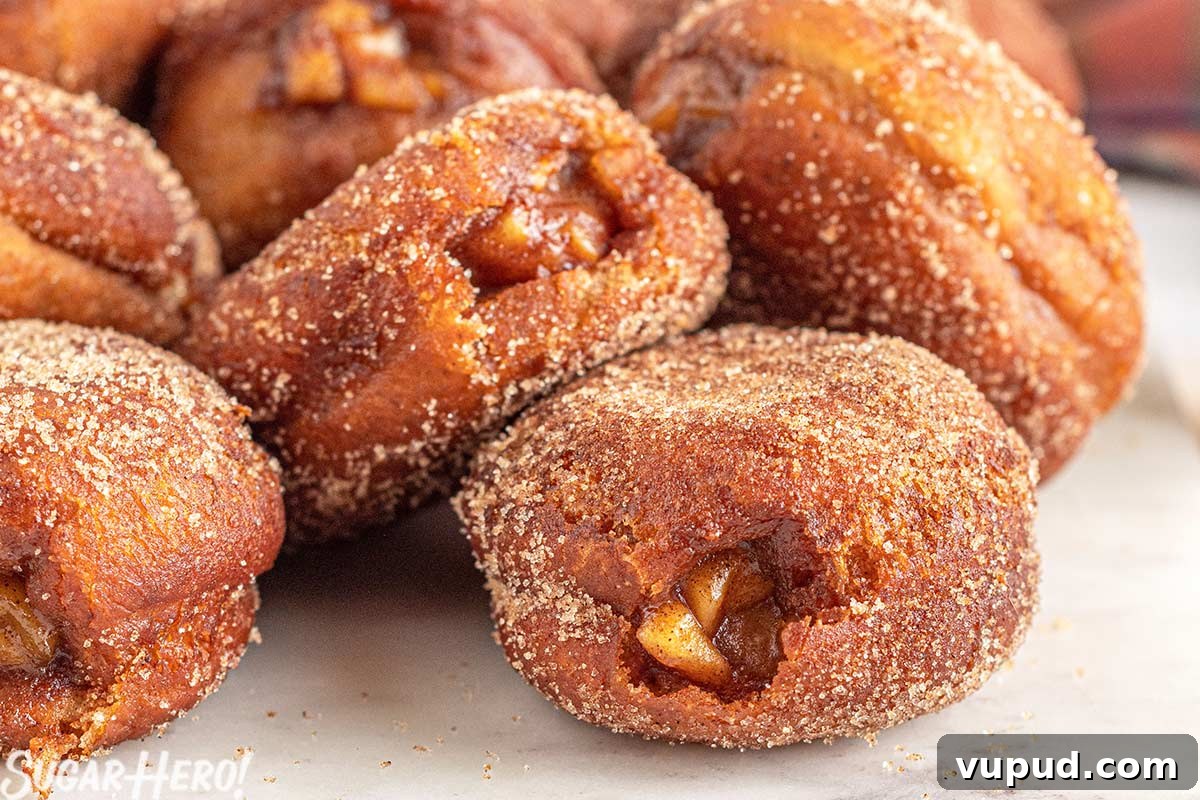 Caramel Apple Donut Recipe: Homemade Baked Apple Donuts with Streusel 6 Close-up of a group of Apple Donuts on a marble surface.
