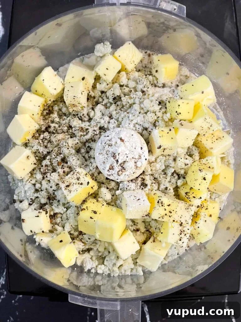 Crispy Blue Cheese Crackers: Homemade Savory Wafers Recipe 4 Flour, cubed butter, crumbled blue cheese, and cracked black pepper in the bowl of a food processor.