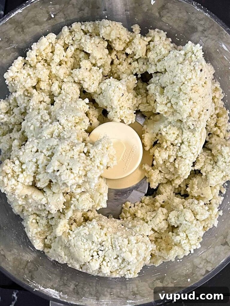 Crispy Blue Cheese Crackers: Homemade Savory Wafers Recipe 5 Blue cheese wafer dough mixed in the bowl of a food processor.