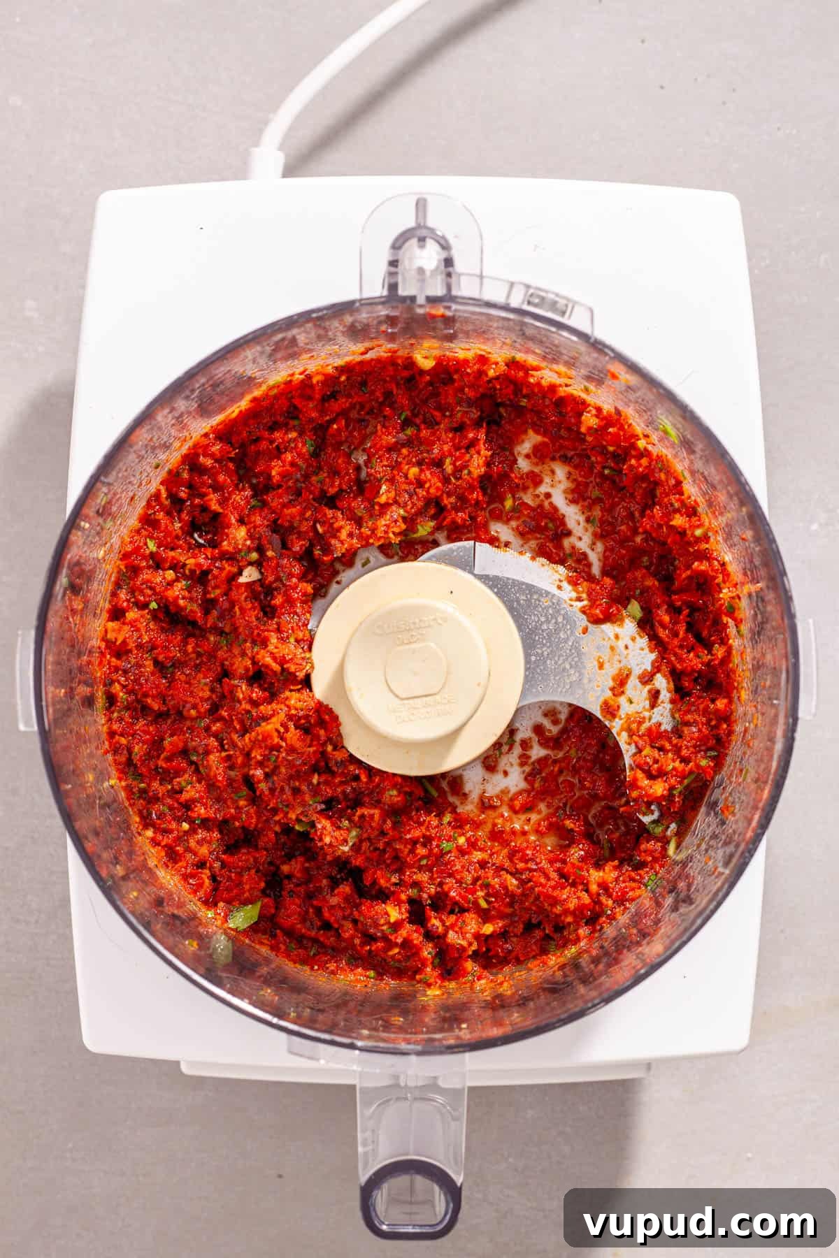 Homemade sun-dried tomato spread in a food processor blended to a paste.