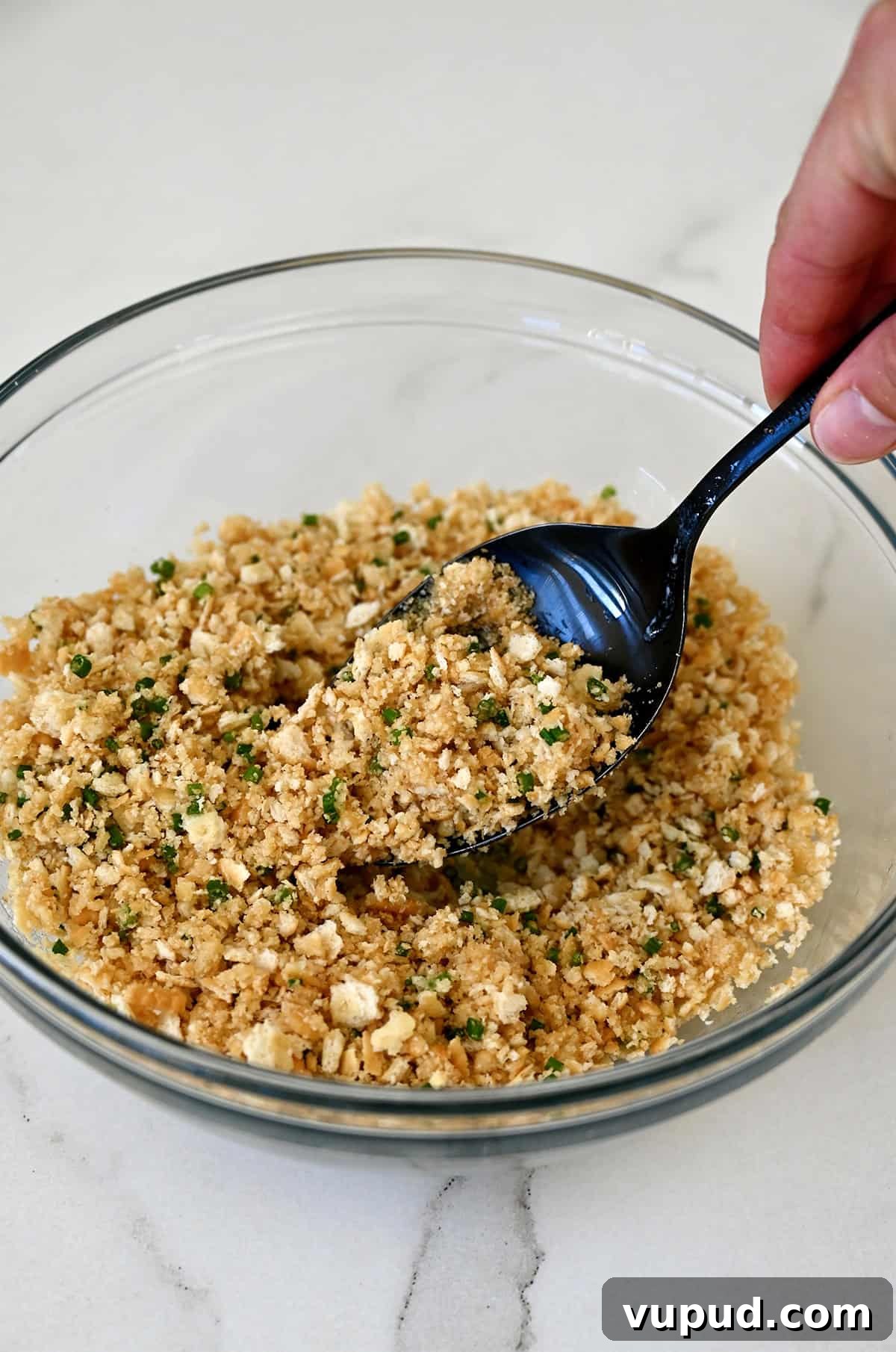 Creamy Jalapeño Popper Dip Recipe for Parties and Game Day 8 Crumb mixture with chopped fresh chives and melted butter in a small bowl.