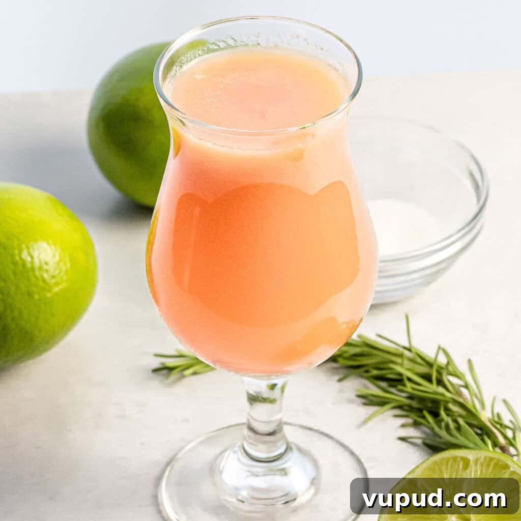 Peach Agua Fresca: Fresh Summer Peach Drink 11 peach agua fresca in a glass next to limes