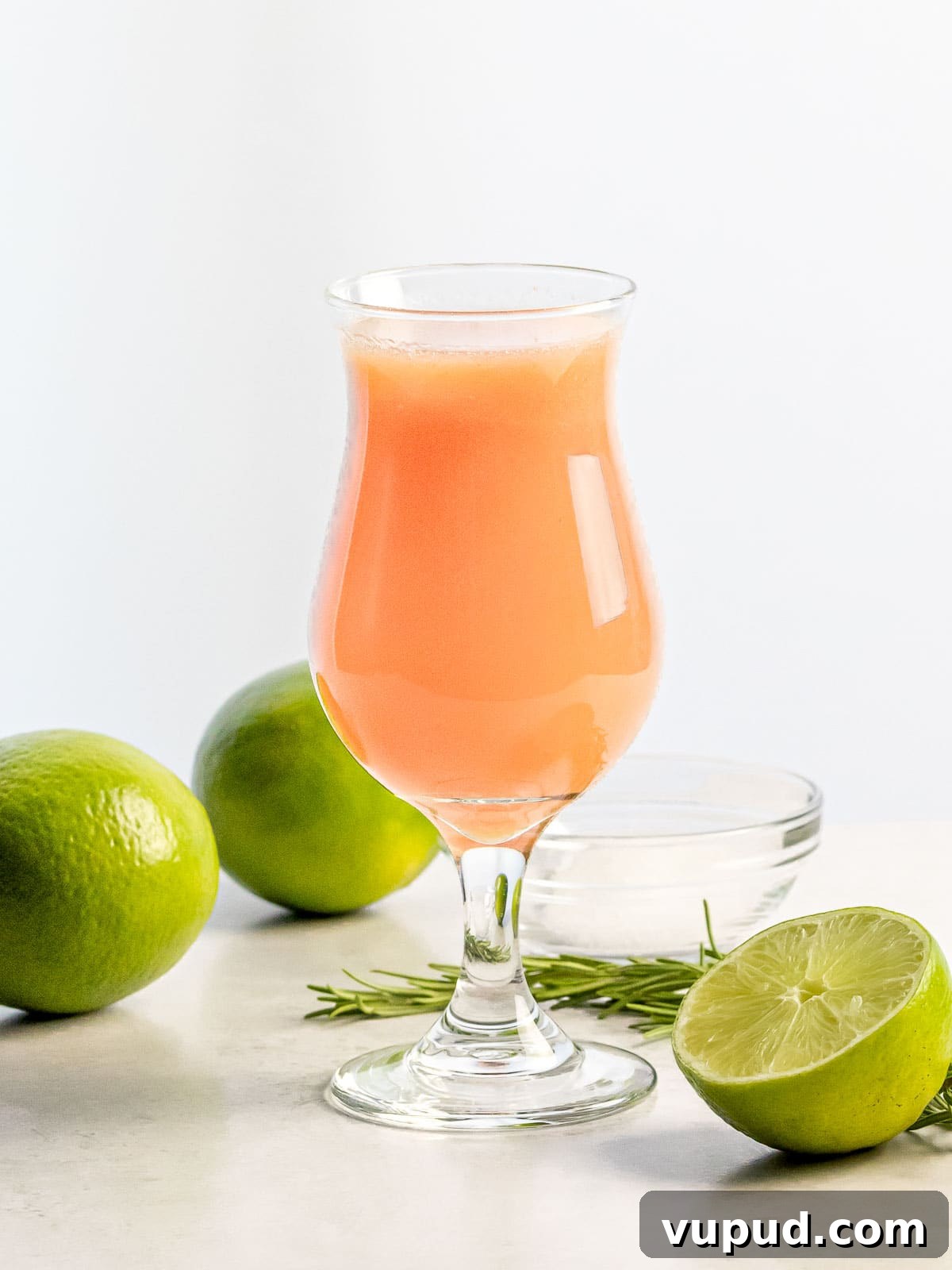 Peach Agua Fresca: Fresh Summer Peach Drink 3 peach agua fresca in a glass next to limes