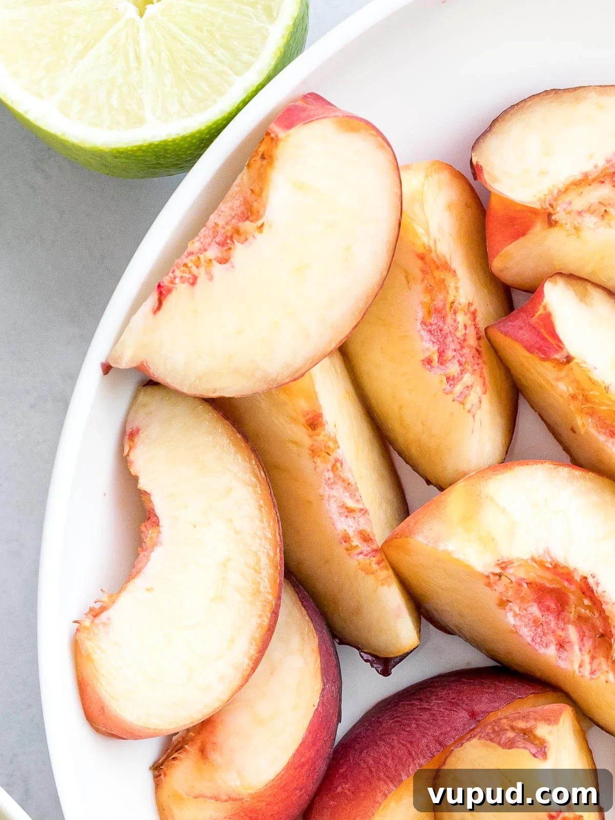 Peach Agua Fresca: Fresh Summer Peach Drink 4 slices of white peaches next to lime