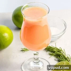 Peach Agua Fresca: Fresh Summer Peach Drink 8 peach agua fresca in a glass next to limes