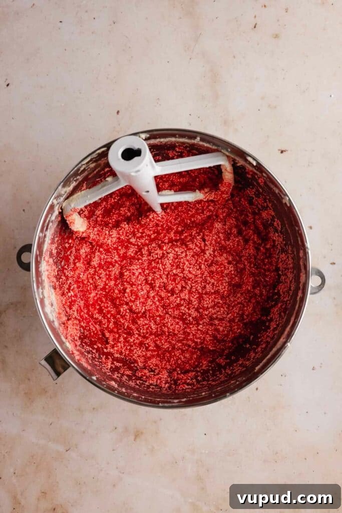 Red Velvet Mini Conversation Heart Cakes — Romantic Valentine Treats 11 Adding red food colouring to red velvet batter