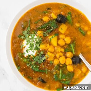 A top down view of a bowl of Moroccan chickpea soup.
