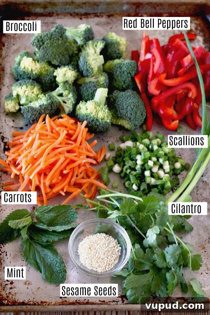 $80 Weekly Meal Plan: 5 Budget-Friendly Dinners for the Week 10 Ingredients to make Asian noodles on a metal surface.
