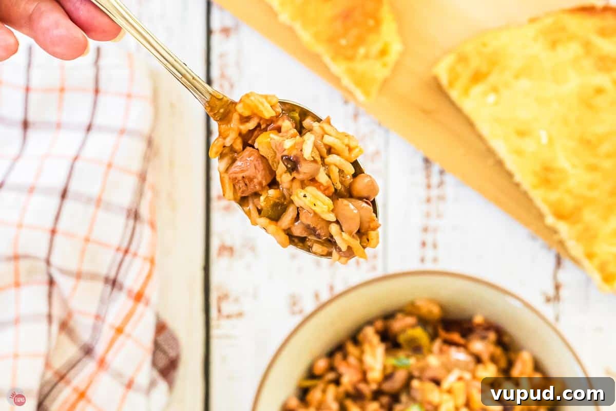 Slow Cooker Hoppin' John Recipe for Flavorful Southern Comfort 3 spoon full of rice and peas