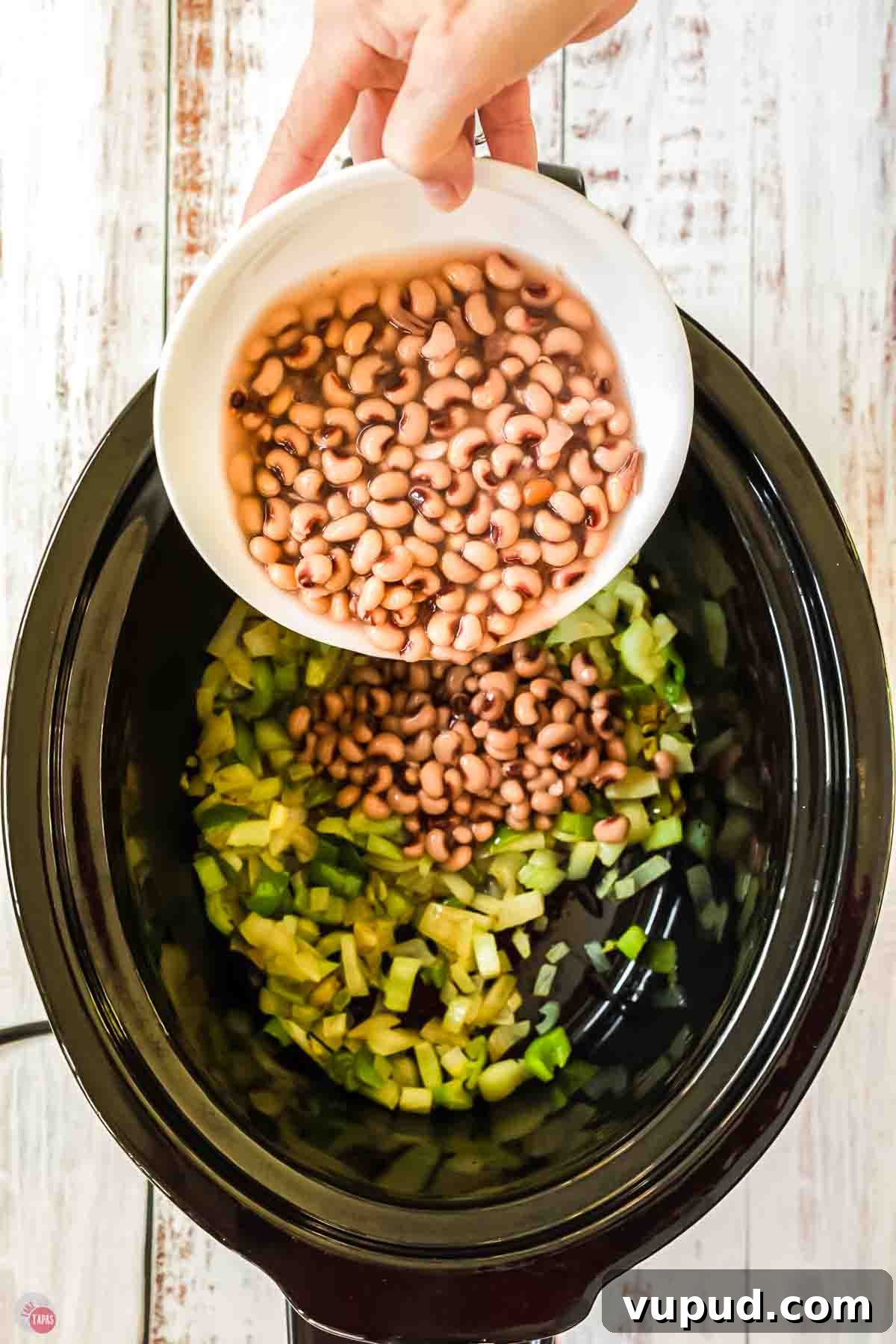 Slow Cooker Hoppin' John Recipe for Flavorful Southern Comfort 5 black eyed peas and celery in a slow cooker pot