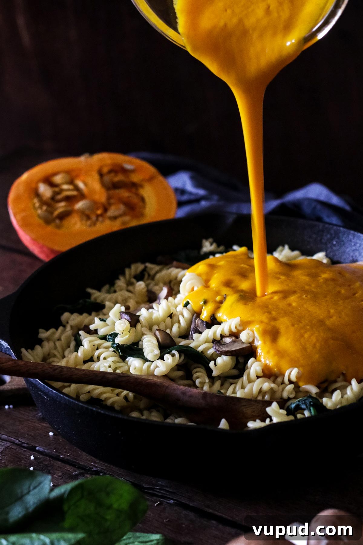 Adding Pumpkin Sauce to the Pasta.
