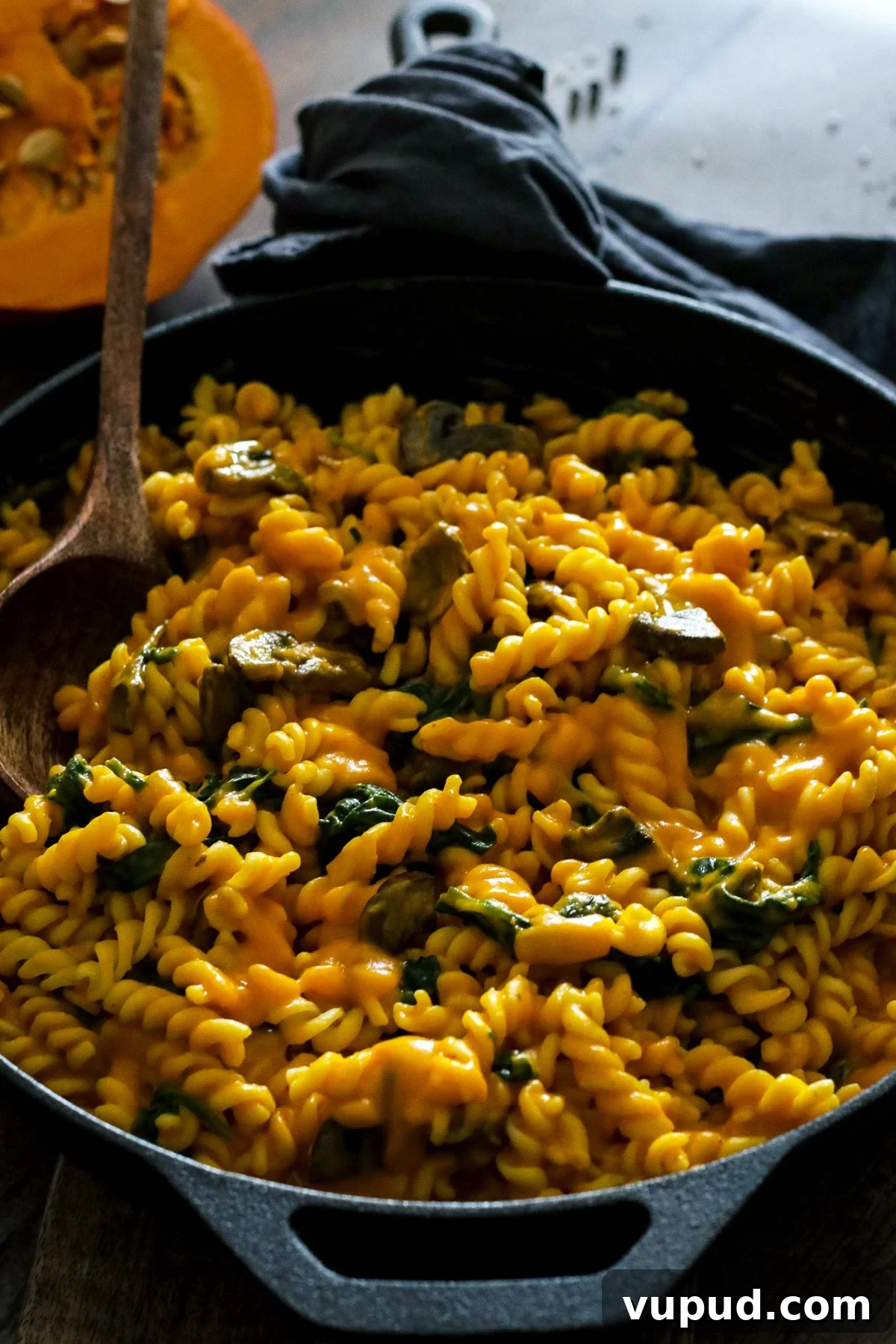 Pumpkin Pasta with Mushrooms and Spinach in a Skillet.