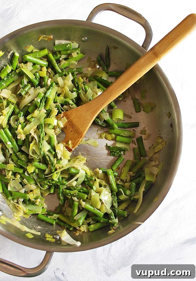 Spring Brown Rice Risotto with Fresh Herbs and Asparagus 3 Brown Rice Spring Risotto - Risotto made with brown rice for added health benefits and more texture. This risotto is packed with spring veggies like leeks, asparagus, and peas! This recipe makes a great side dish or add shrimp for a complete meal! Vegetarian/Gluten Free | robustrecipes.com