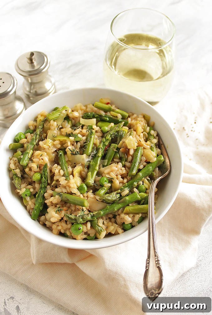 Spring Brown Rice Risotto with Fresh Herbs and Asparagus 5 Brown Rice Spring Risotto - Risotto made with brown rice for added health benefits and more texture. This risotto is packed with spring veggies like leeks, asparagus, and peas! This recipe makes a great side dish or add shrimp for a complete meal! Vegetarian/Gluten Free | robustrecipes.com