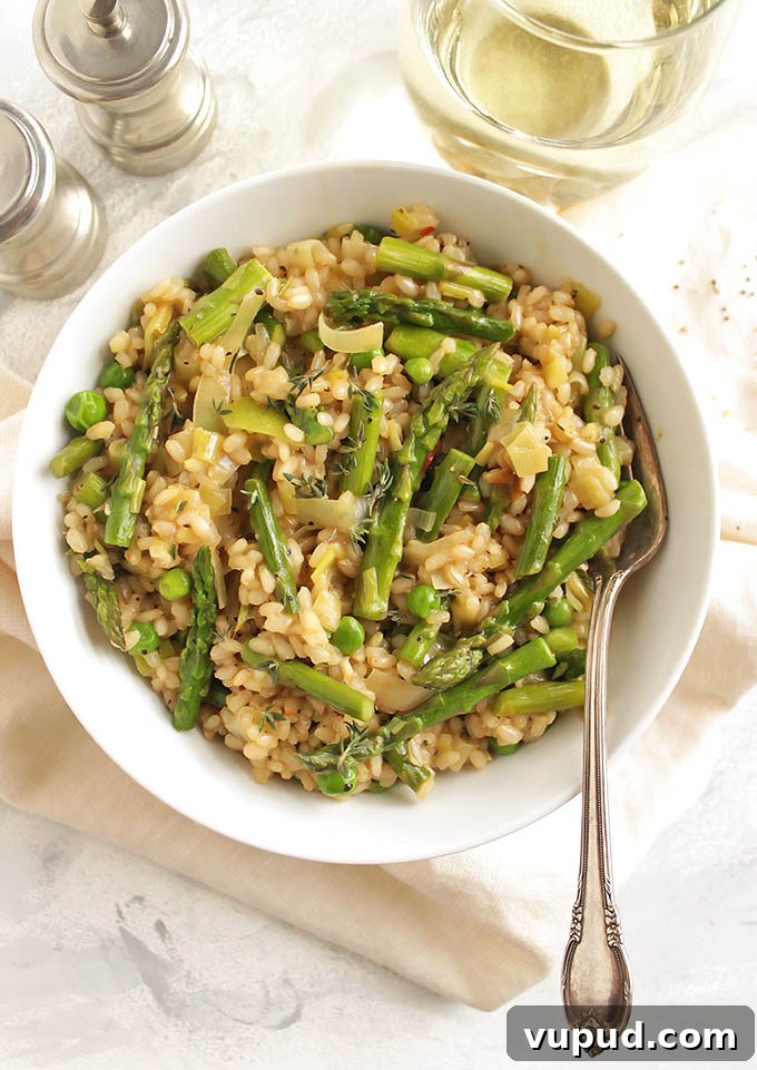 Spring Brown Rice Risotto with Fresh Herbs and Asparagus 6 Brown Rice Spring Risotto - Risotto made with brown rice for added health benefits and more texture. This risotto is packed with spring veggies like leeks, asparagus, and peas! This recipe makes a great side dish or add shrimp for a complete meal! Vegetarian/Gluten Free | robustrecipes.com