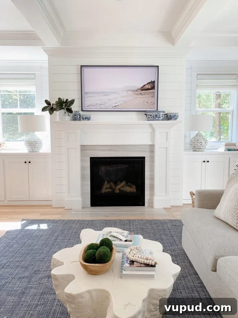 What Size Samsung The Frame TV Should You Mount Above a Fireplace? 5 55" Samsung Frame tv in a living room