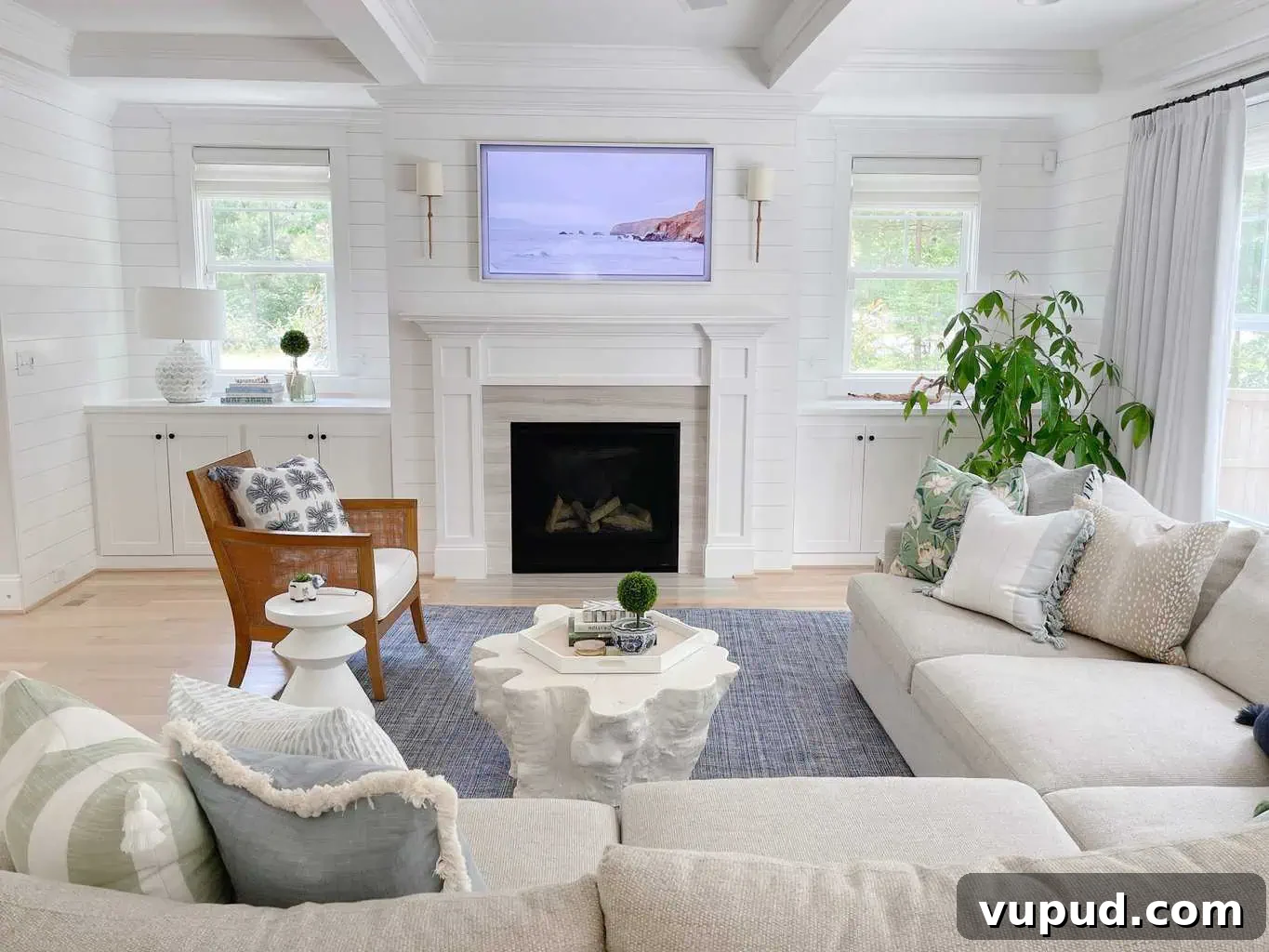 What Size Samsung The Frame TV Should You Mount Above a Fireplace? 6 55" frame TV over fireplace in a living room