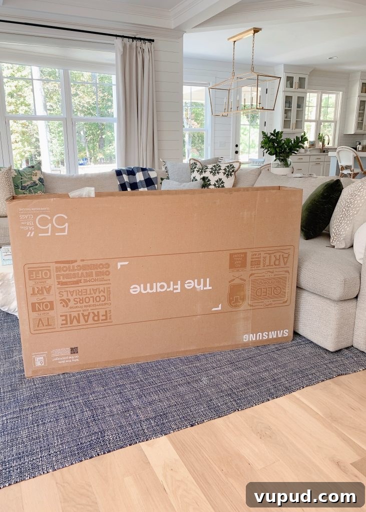 What Size Samsung The Frame TV Should You Mount Above a Fireplace? 7 Samsung Frame tv in a box