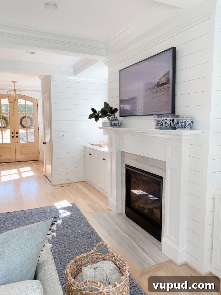What Size Samsung The Frame TV Should You Mount Above a Fireplace? 8 a blue and white living room