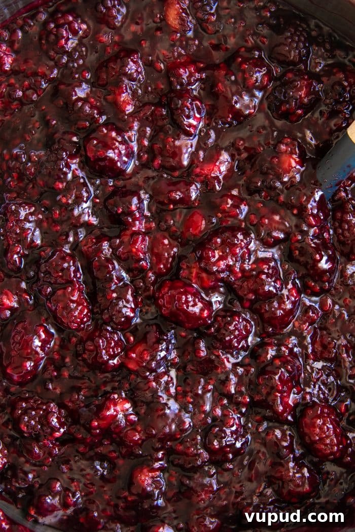 Classic Blackberry Cobbler Recipe: Sweet, Juicy, Homemade Dessert 5 Fresh blackberries simmering in a pot with sugar.