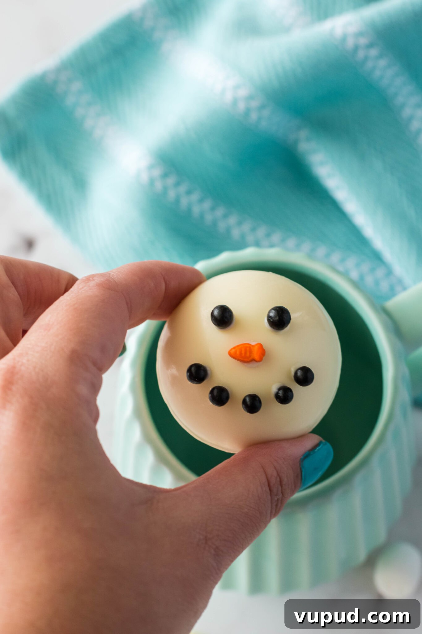 Snowman Hot Chocolate Bombs Recipe for Cozy Winter Drinks 6 snowman hot chocolate bomb over a mug