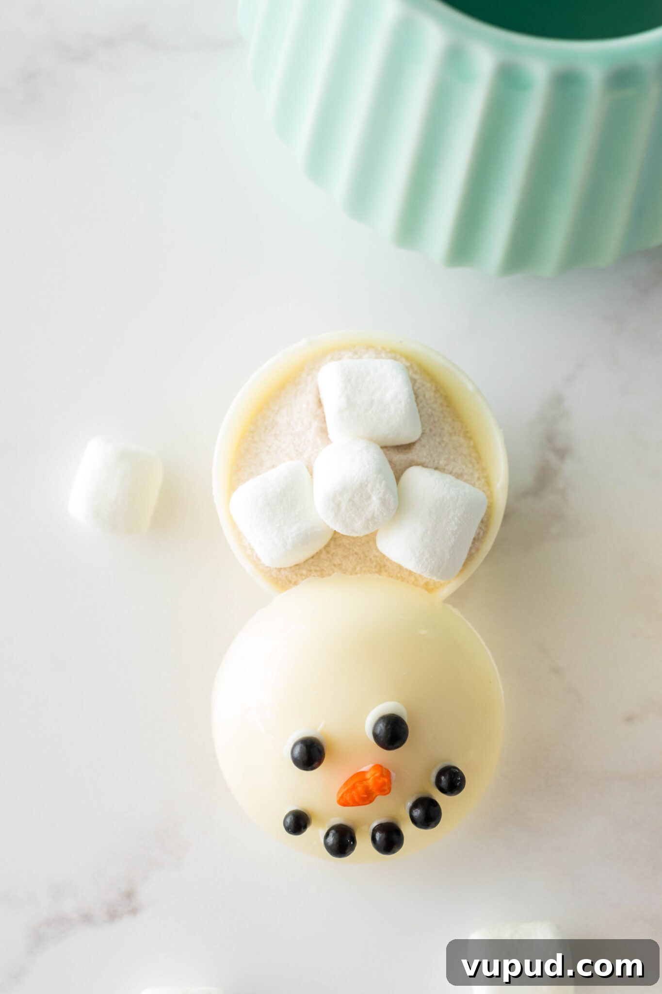 Snowman Hot Chocolate Bombs Recipe for Cozy Winter Drinks 7 open snowman hot chocolate bomb near mug