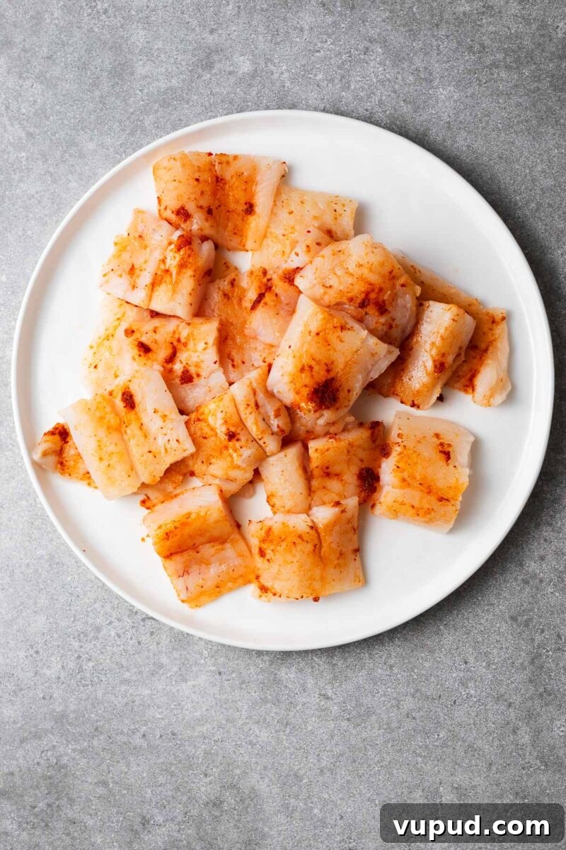 Authentic Thai Red Curry with Fish: Quick Flavorful Recipe 4 Large even-sized chunks of white fish rubbed with red curry paste.