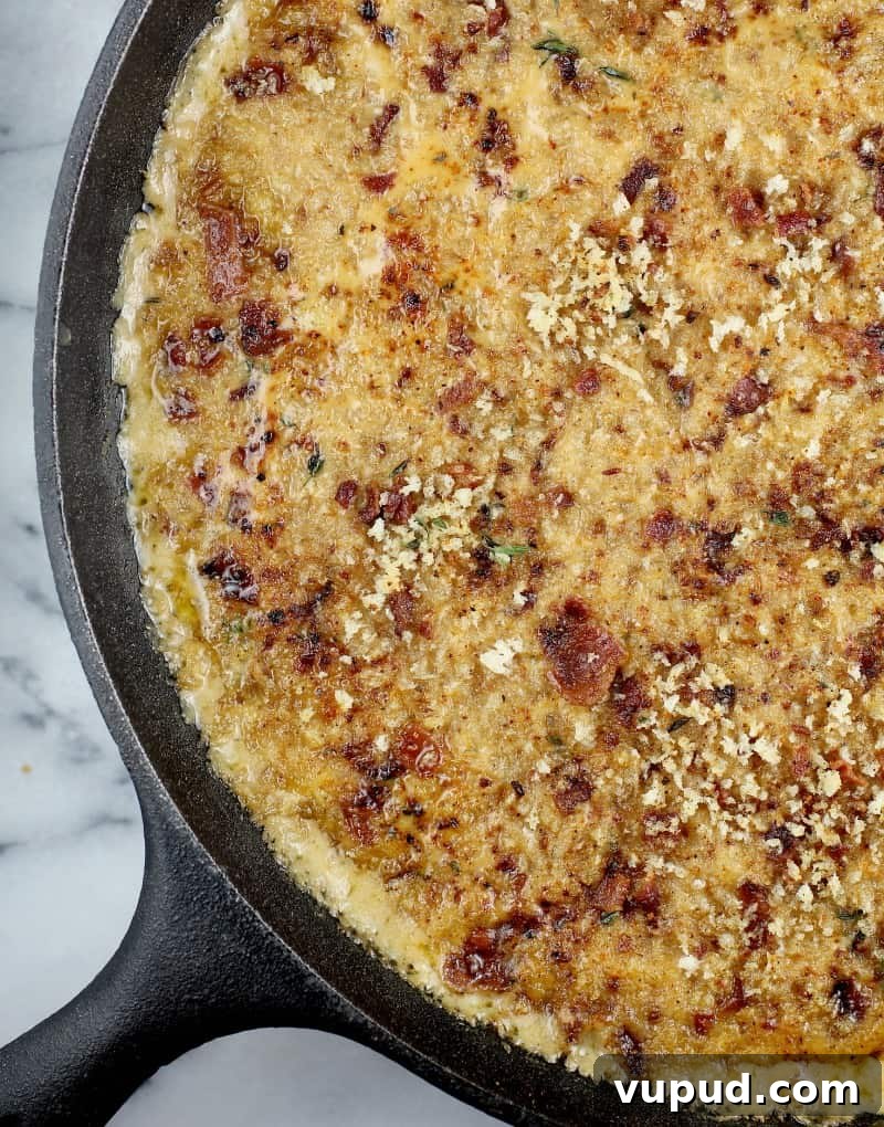 Garlic, Bacon & Beer Macaroni and Cheese Recipe 12 top down view of the cooked bacon macaroni and cheese in a large cast iron skillet