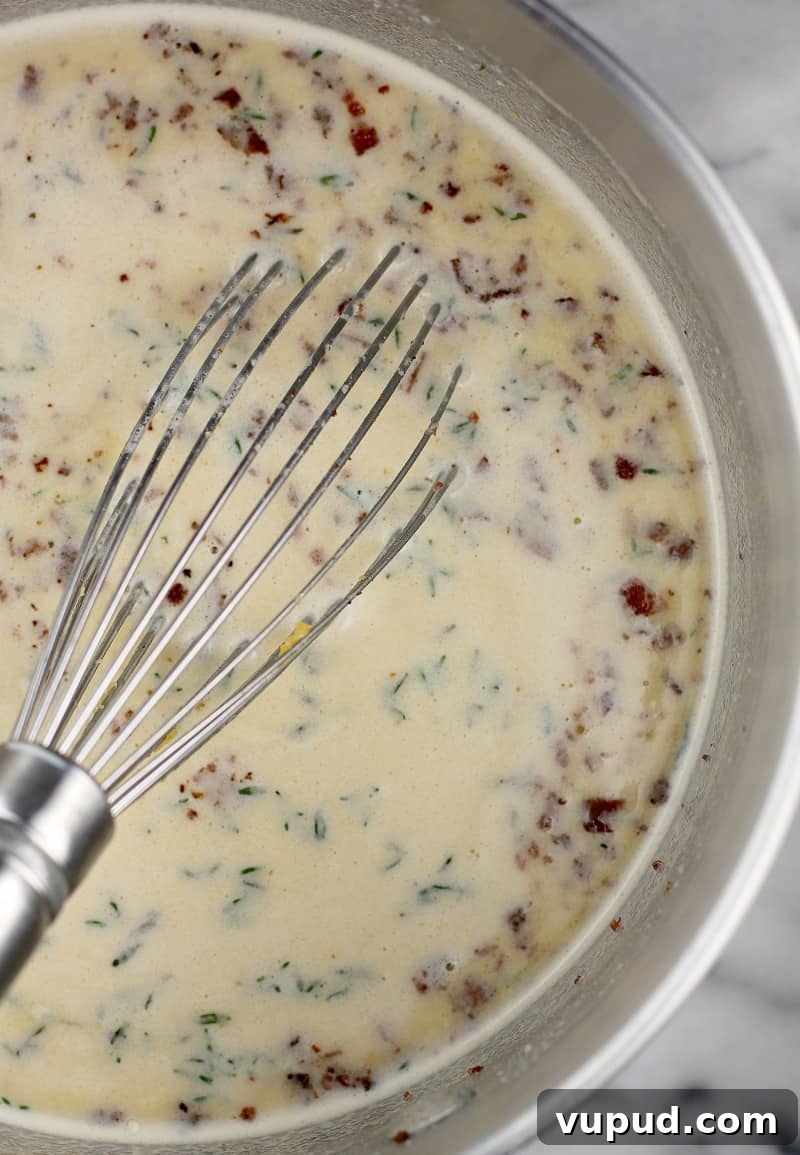 Garlic, Bacon & Beer Macaroni and Cheese Recipe 7 finished cheese sauce with bacon pieces floating on top