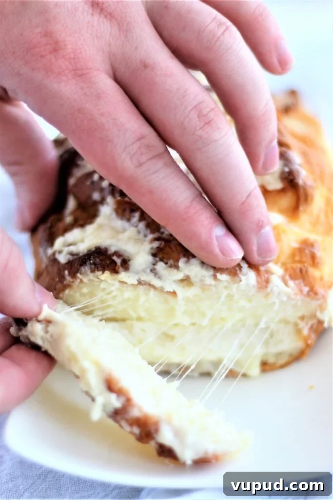 Gluten-Free Cheesy Stuffed Bread Recipe for Homemade Comfort 4 pulling gluten free cheesy bread apart