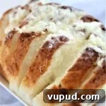 Gluten-Free Cheesy Stuffed Bread Recipe for Homemade Comfort 5 gluten free cheesy bread on white platter