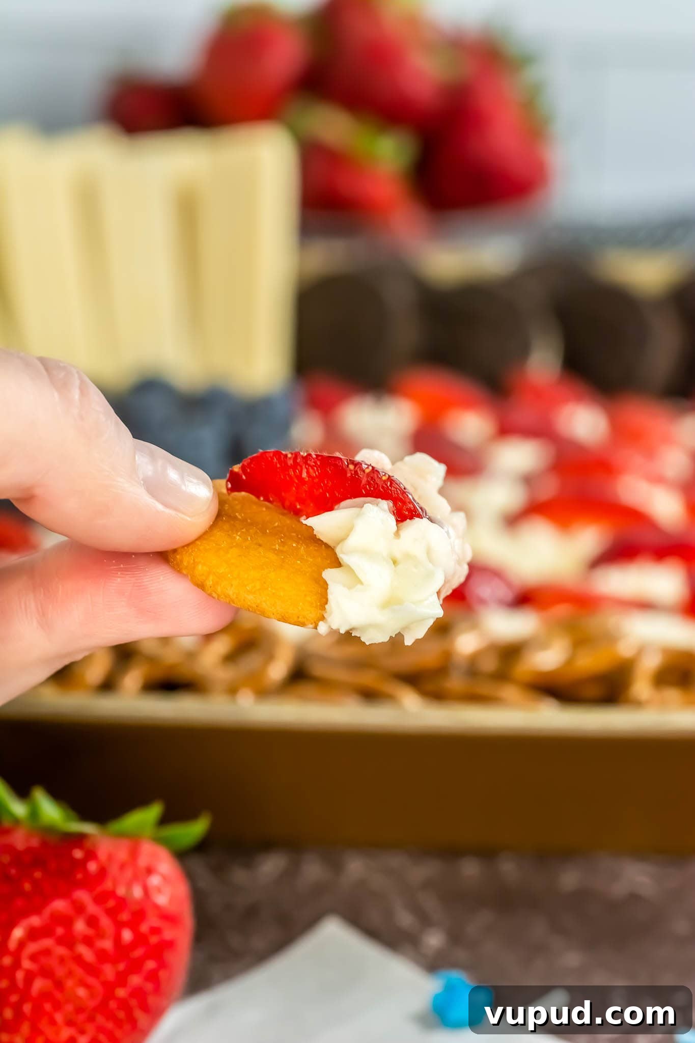 Patriotic 4th of July Flag Frosting Board Ideas for Entertaining 12 pretzel with the frosting and a strawberry