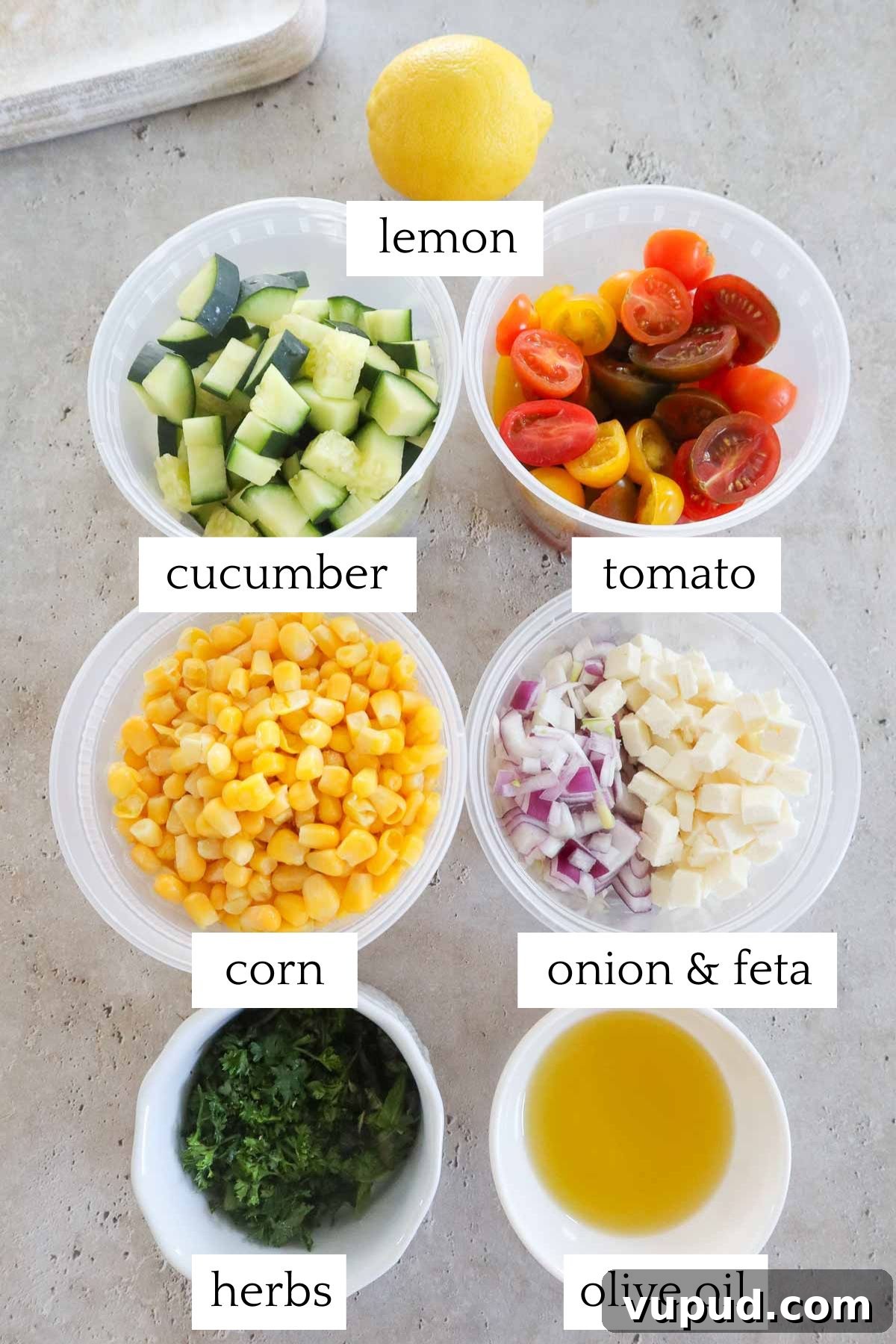 measured and labeled ingredients to make tomato corn cucumber salad.