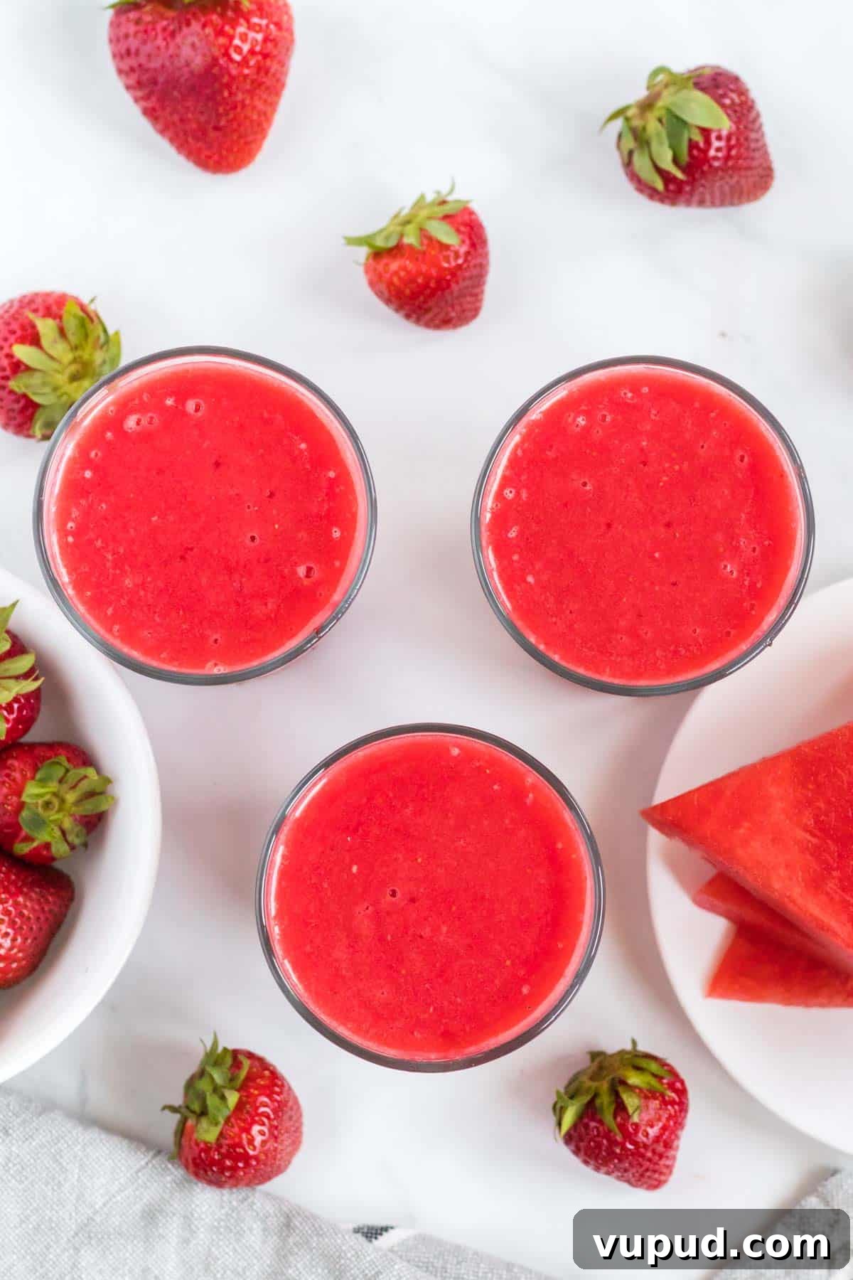 Refreshing Strawberry Watermelon Smoothie Recipe for Summer 5 3 watermelon strawberry smoothies from an overhead view