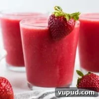 Refreshing Strawberry Watermelon Smoothie Recipe for Summer 9 strawberry watermelon smoothie in a glass with a strawberry on the rim