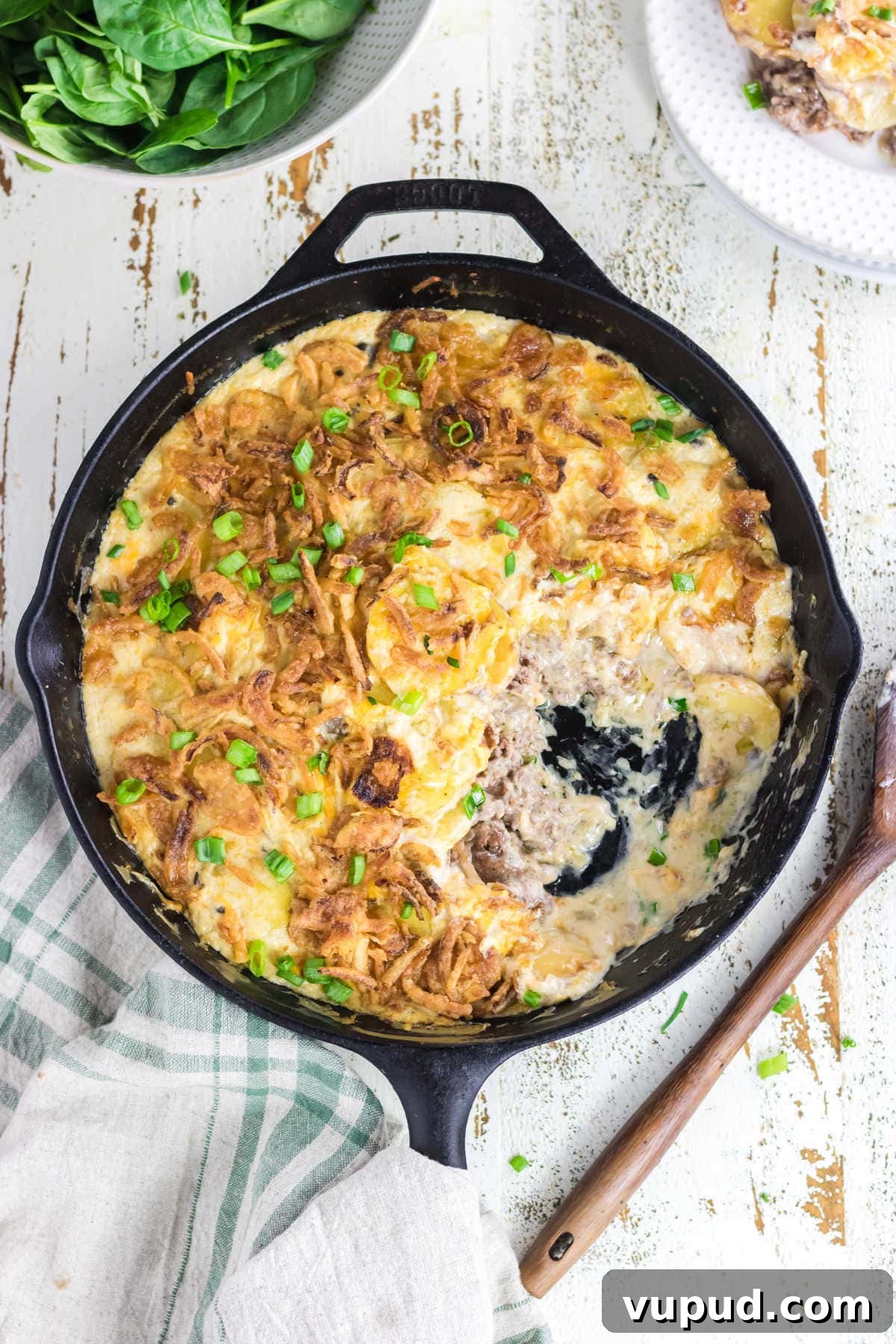 Classic Hobo Casserole Recipe for Hearty Weeknight Meals 2 Overhead view of the casserole with a serving removed showing the creamy sauce that's left in the pan.