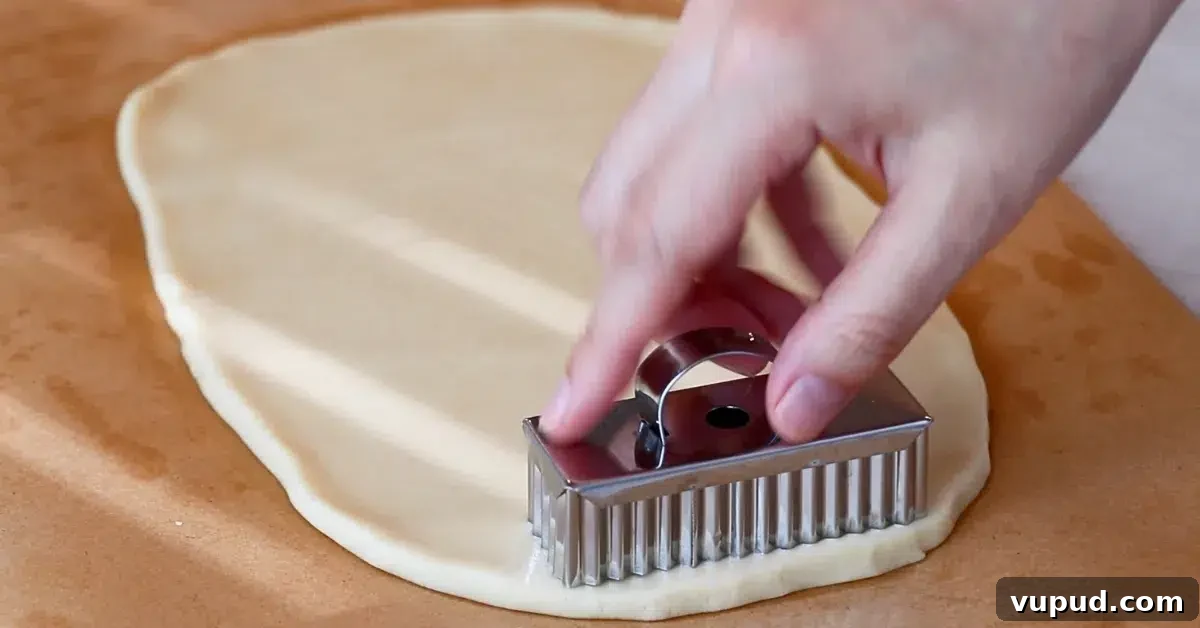 Classic Buttery Shortbread Cookies Recipe for Perfect Cookies 14 cutting shortbread cookie dough with a rectangle cookie cutter