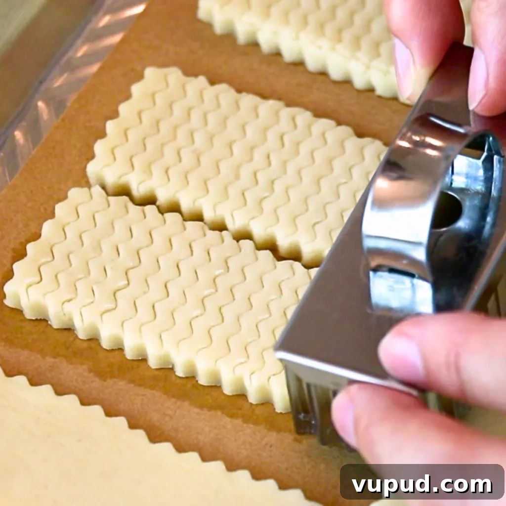 Classic Buttery Shortbread Cookies Recipe for Perfect Cookies 16 adding pretty patterns on shortbread cookie dough with a cookie cutter.