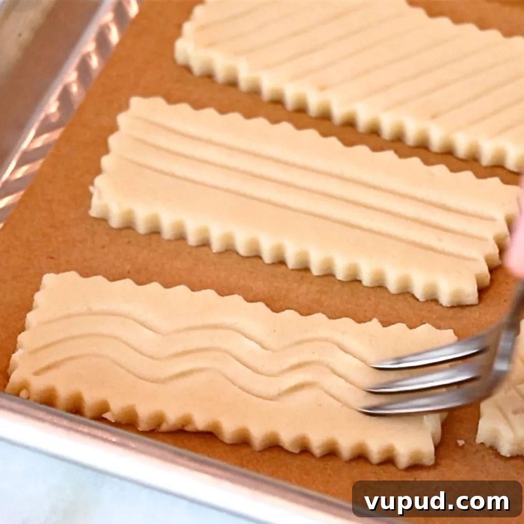 Classic Buttery Shortbread Cookies Recipe for Perfect Cookies 18 adding wavy lines on shortbread cookie dough with a fork
