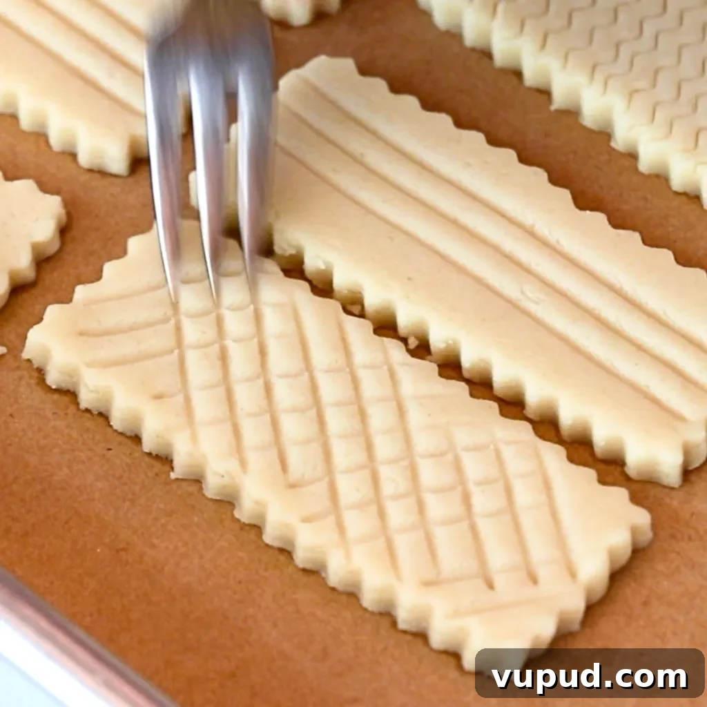 Classic Buttery Shortbread Cookies Recipe for Perfect Cookies 19 adding mesh patterns on shortbread cookie dough with a fork