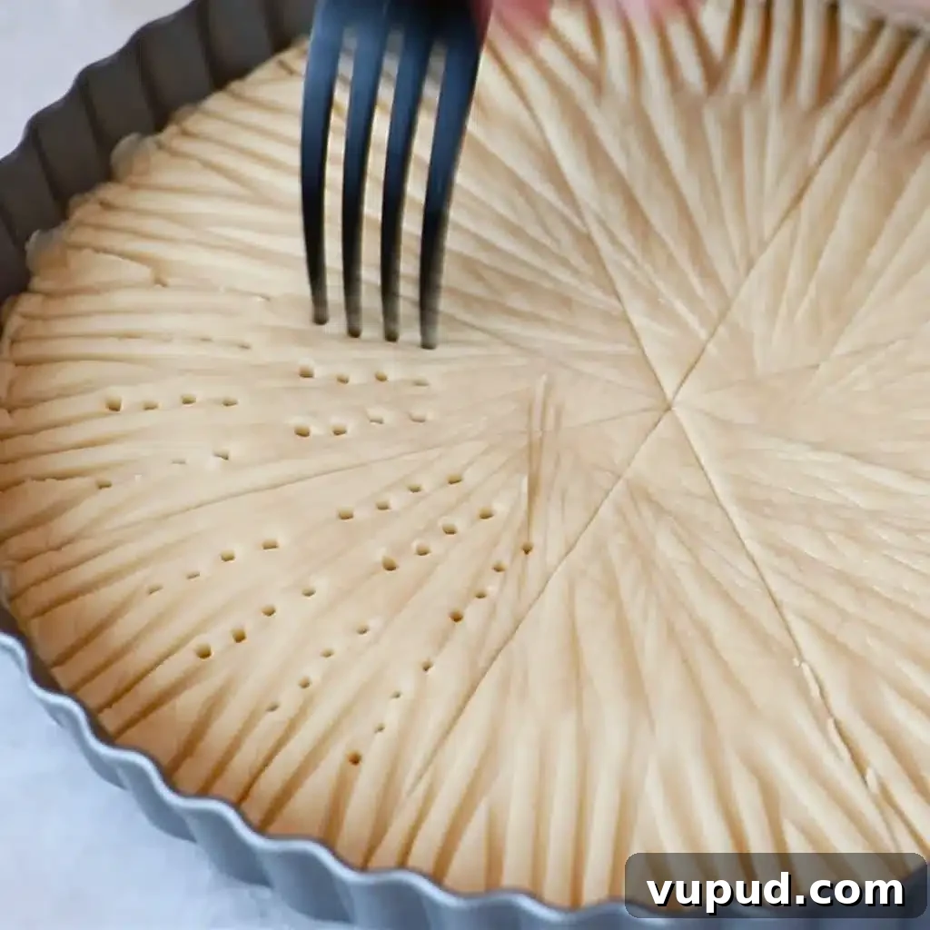 Classic Buttery Shortbread Cookies Recipe for Perfect Cookies 35 poking pressed shortbread cookie dough with a fork