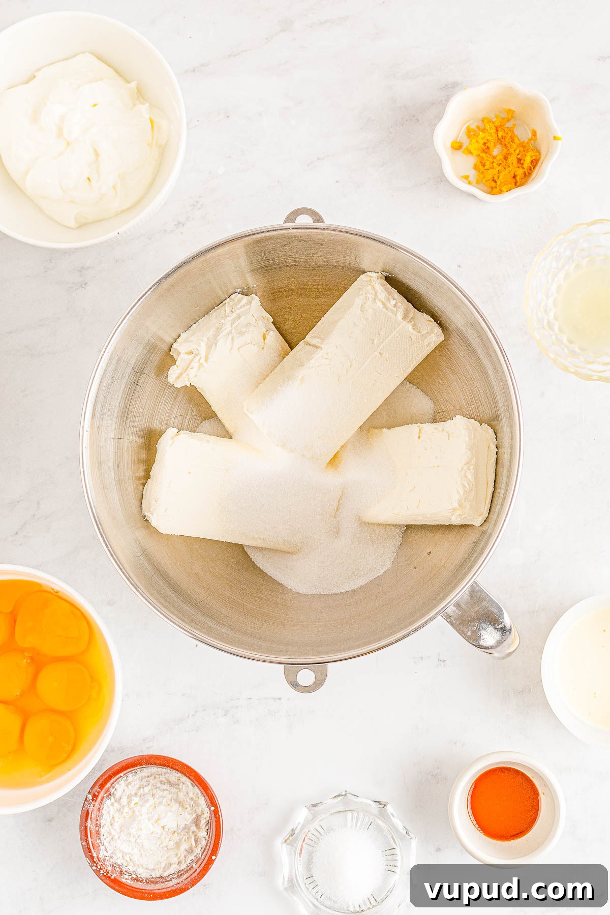 Classic New York Cheesecake Recipe: Creamy Oven-Baked Slice 12 Cheesecake filling ingredients in a bowl.